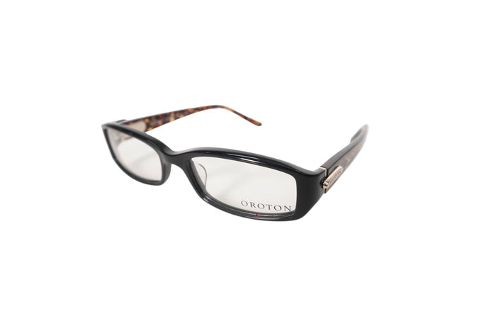 Black eyeglasses with tortoiseshell accents on a white background