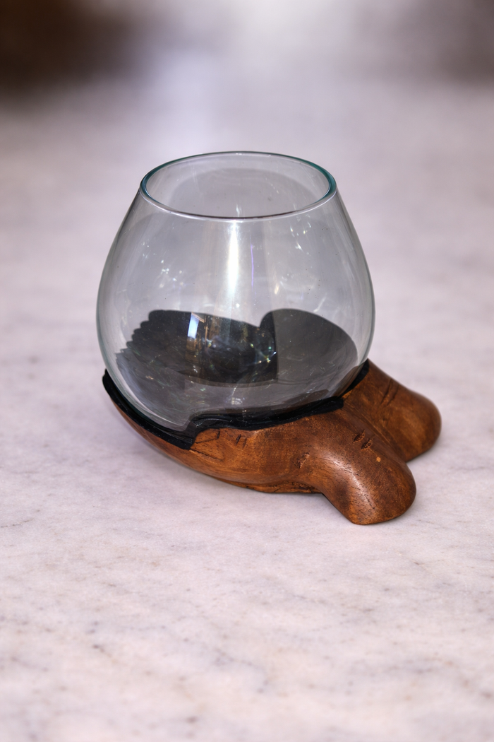 Slump vase on wooden carved hands